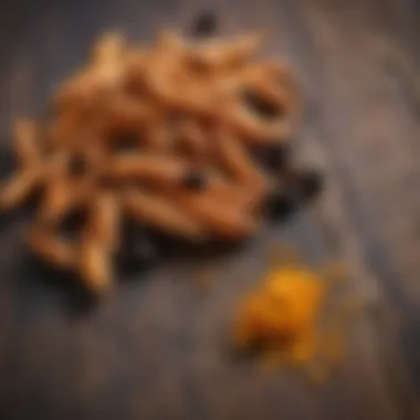 Natural Ingredients: Turmeric and Black Pepper Close-up of turmeric root and black peppercorns on a wooden surface.